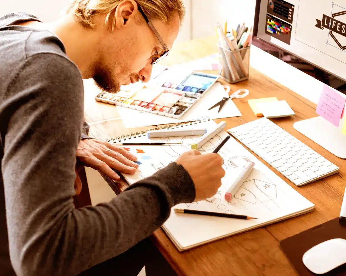 Designer sketching website wireframes