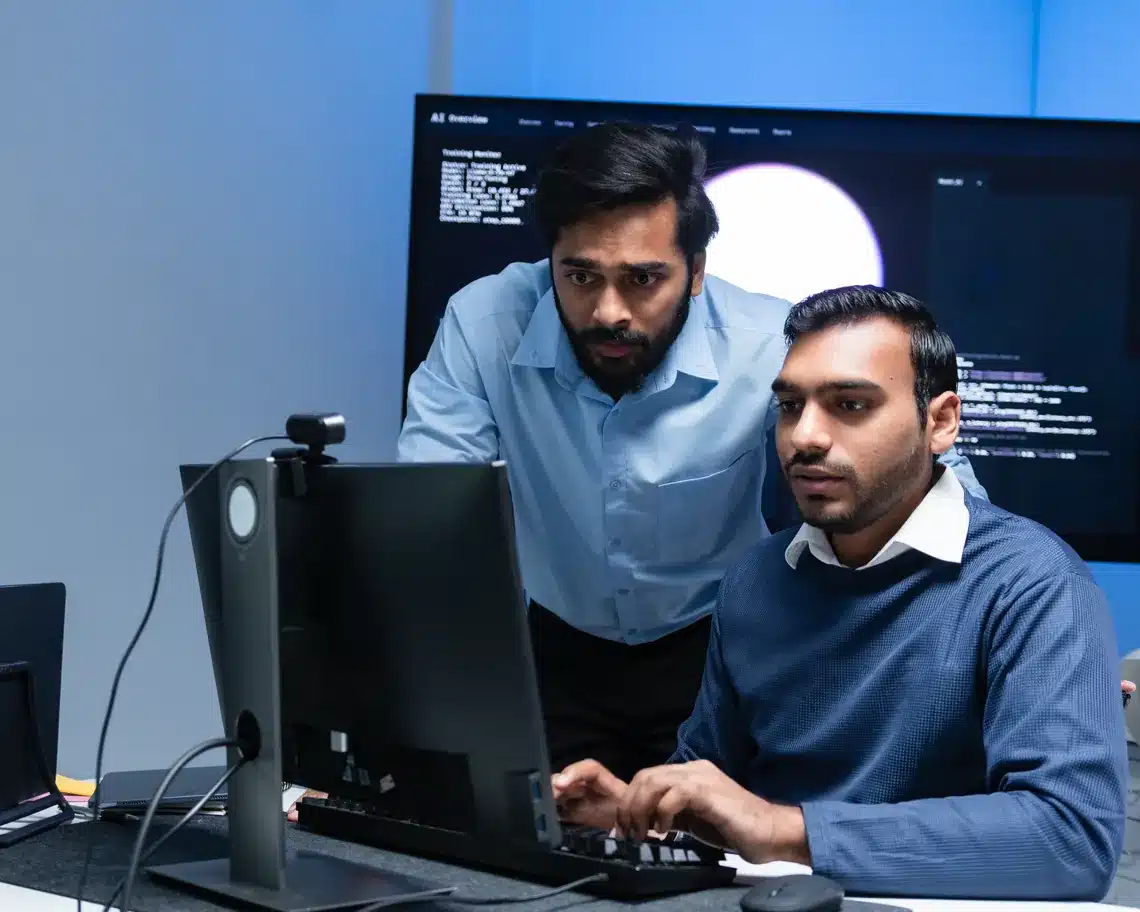 Developers reviewing site code together