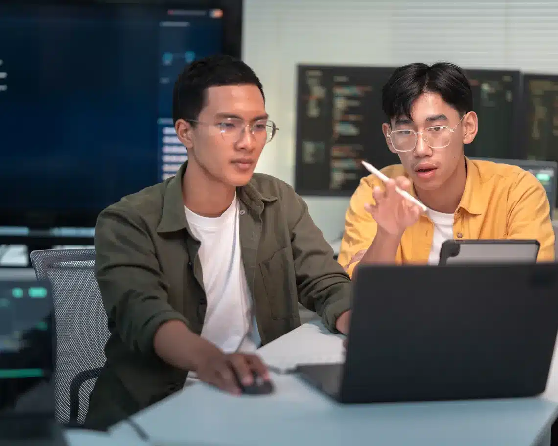 Team working on AI project laptop